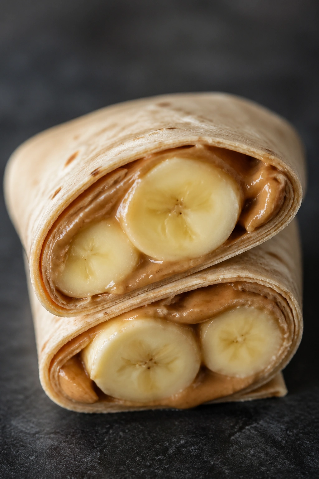 Cross-section of banana tortilla wrap with almond butter filling