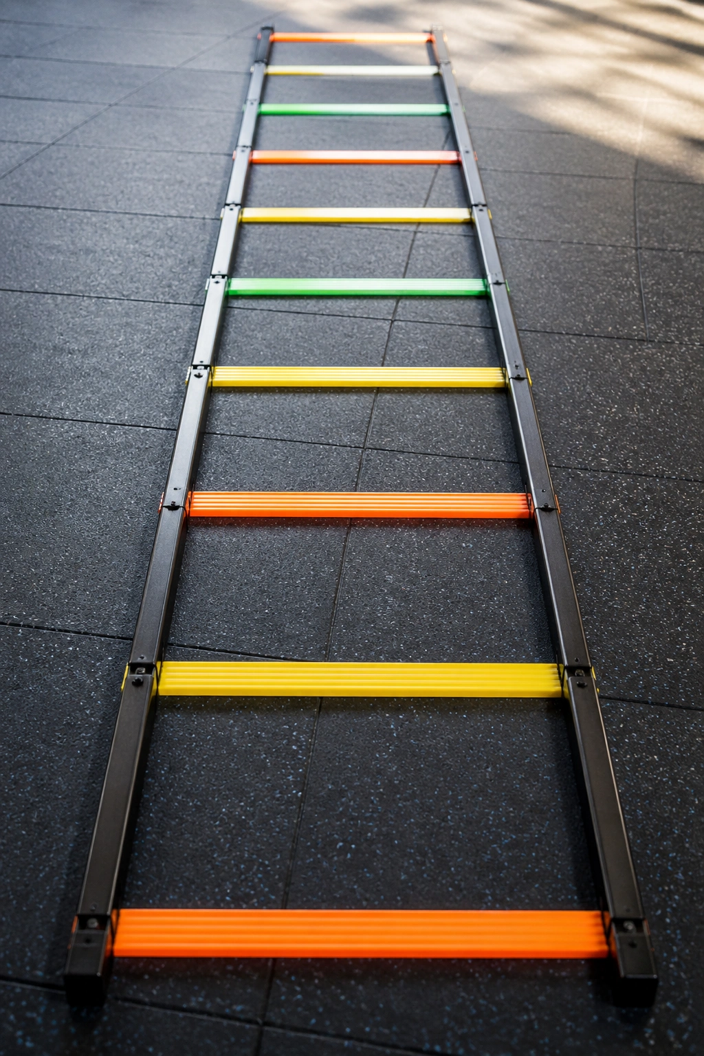 Close-up of an endurance ladder on a gym floor with visible rungs