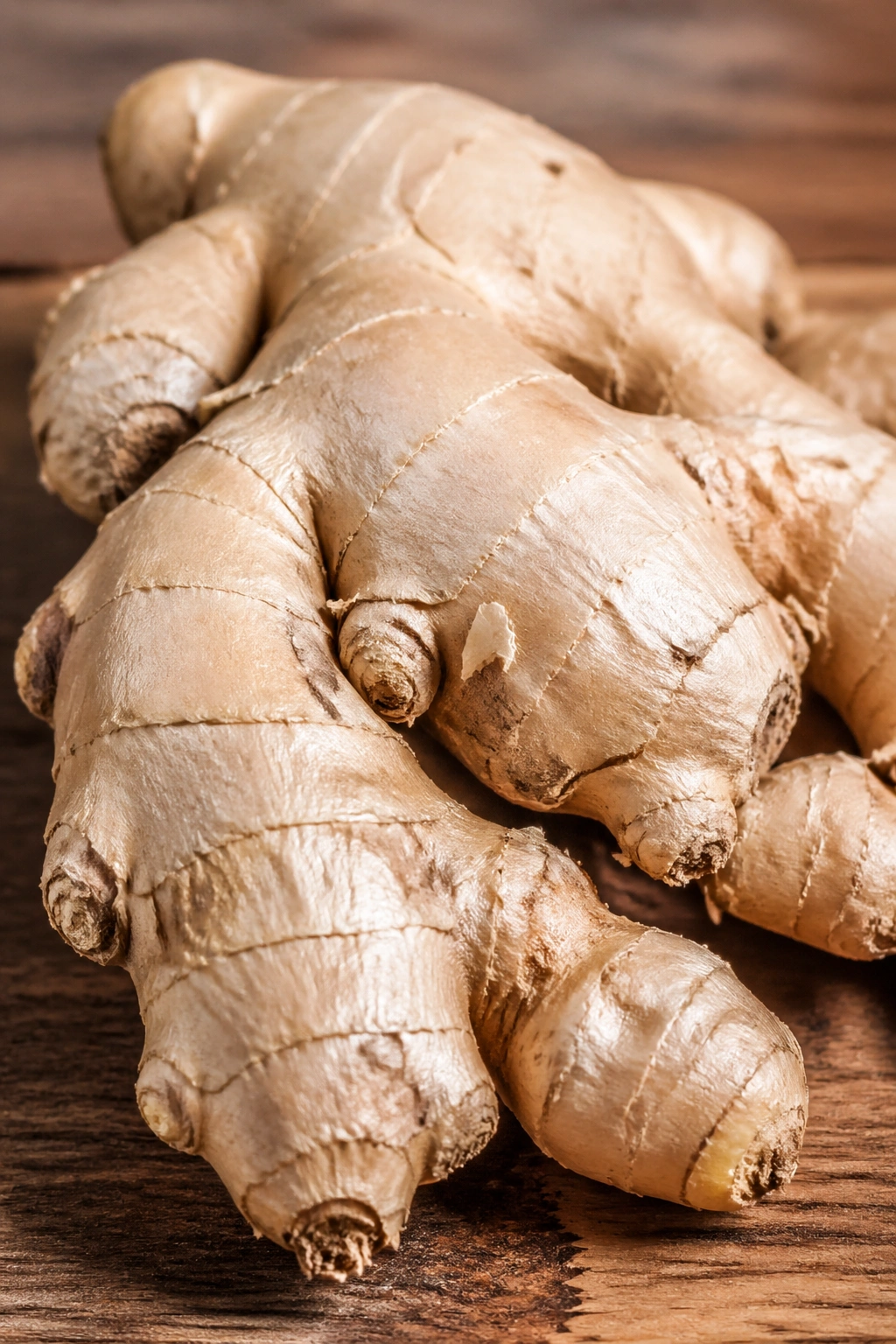 Close-up of fresh ginger root on wood