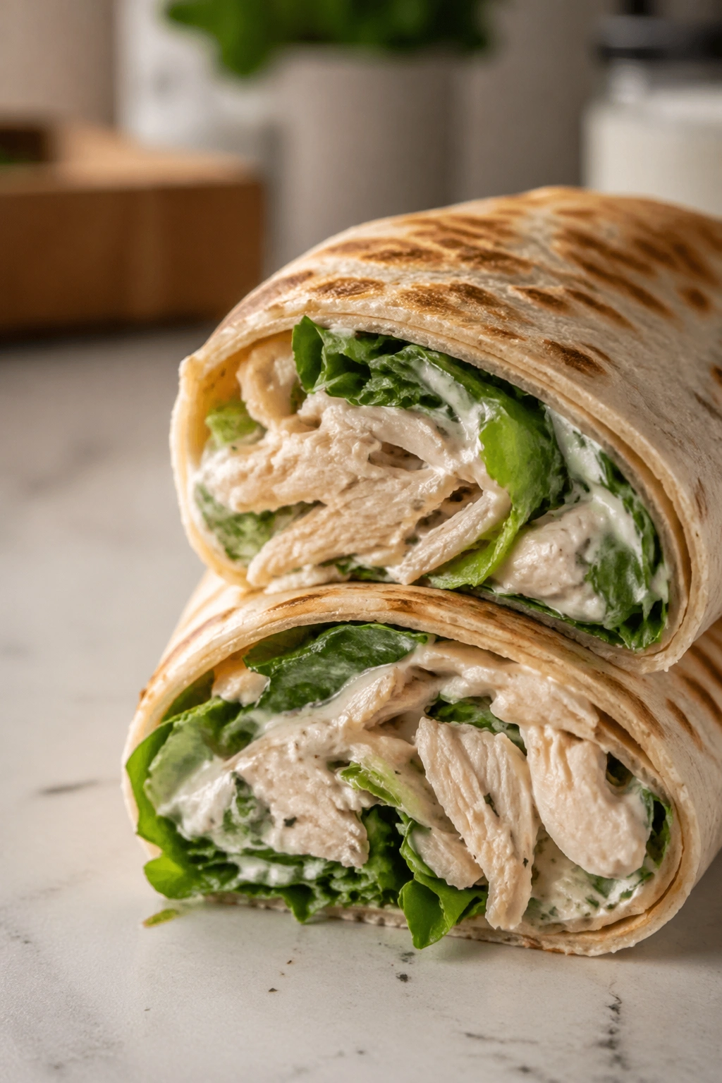 Close-up of Greek yogurt ranch chicken wraps with lettuce and filling