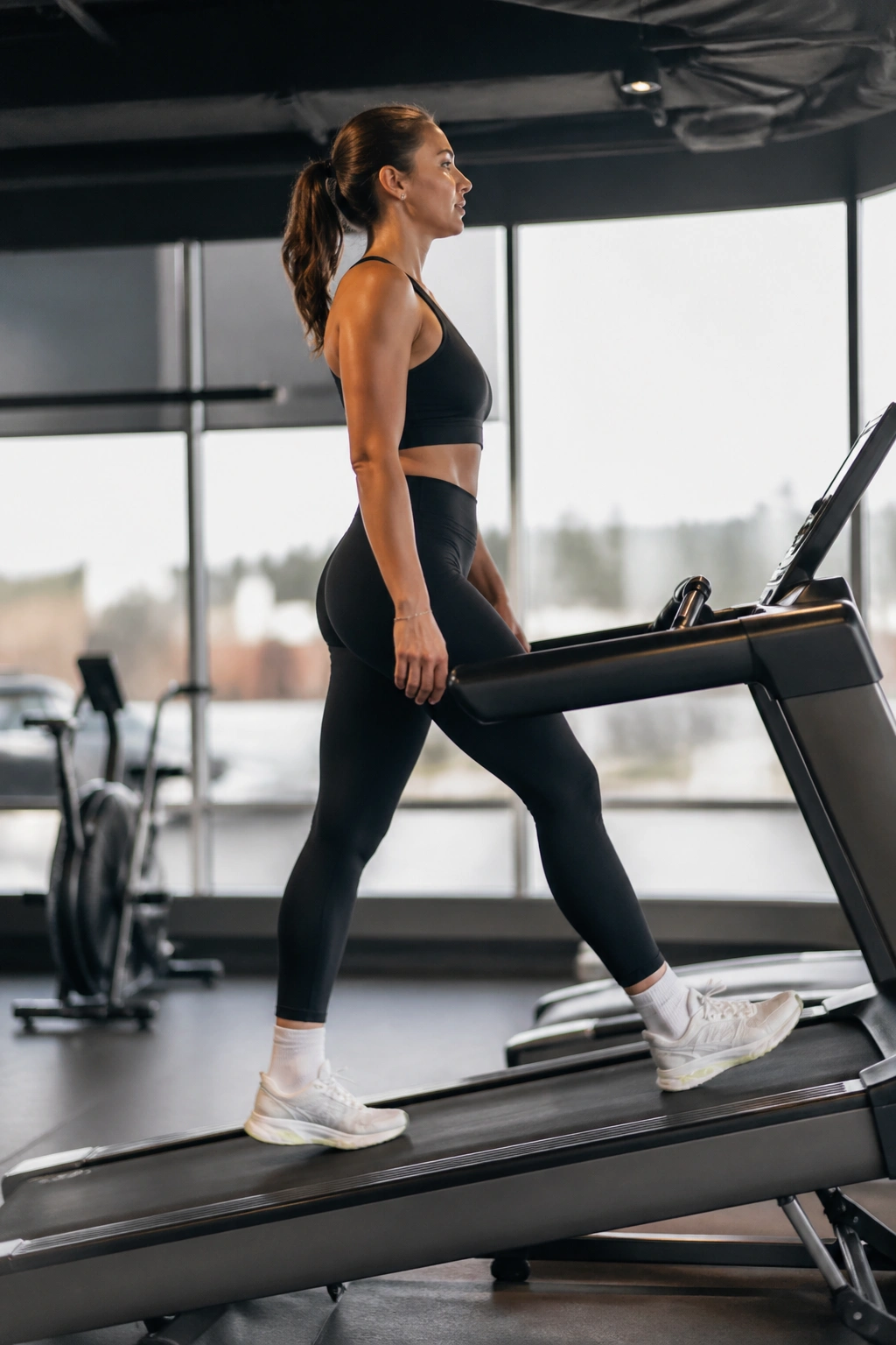 Person on incline treadmill walking with good form