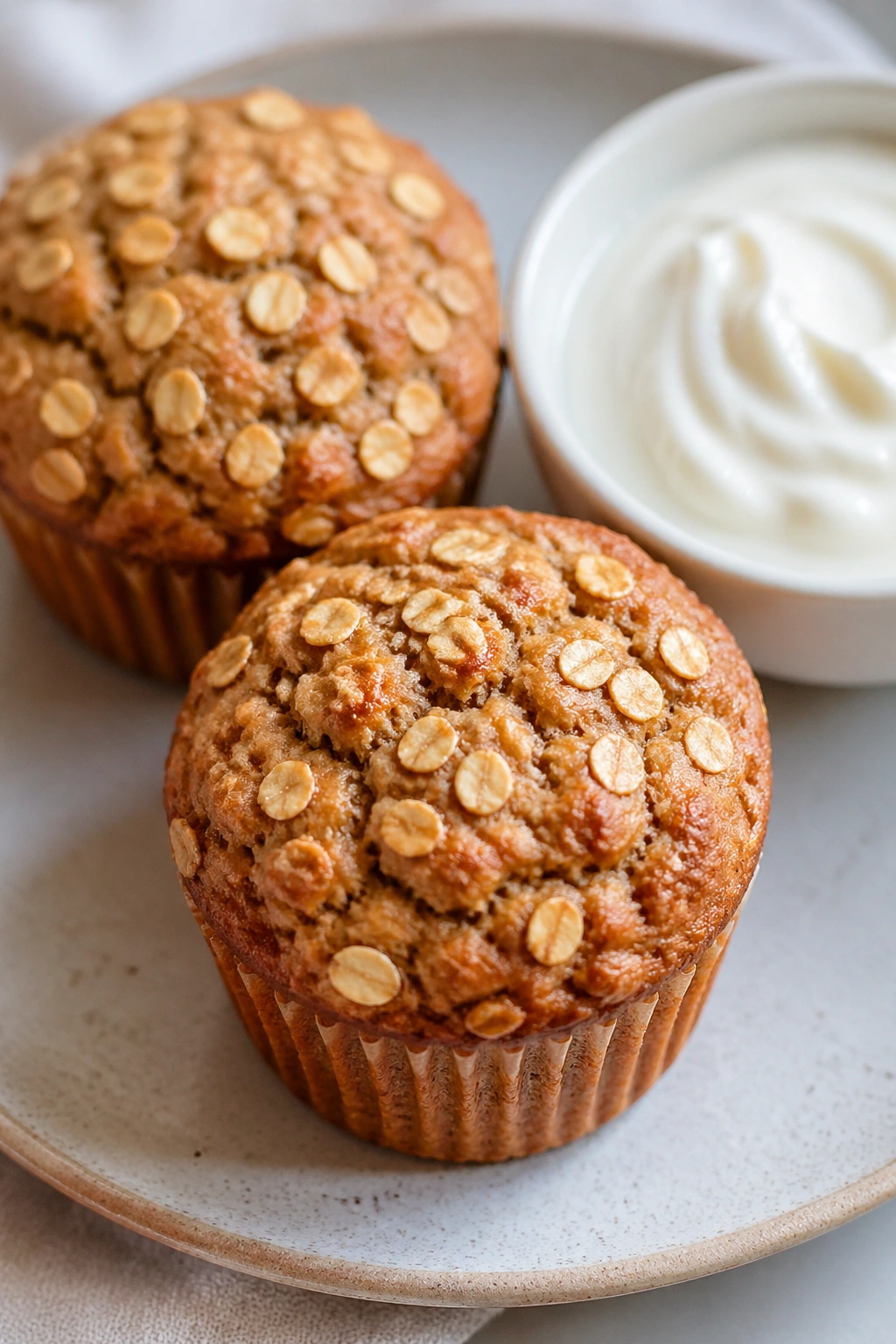 Close-up of oatmeal muffins with Greek yogurt on the side