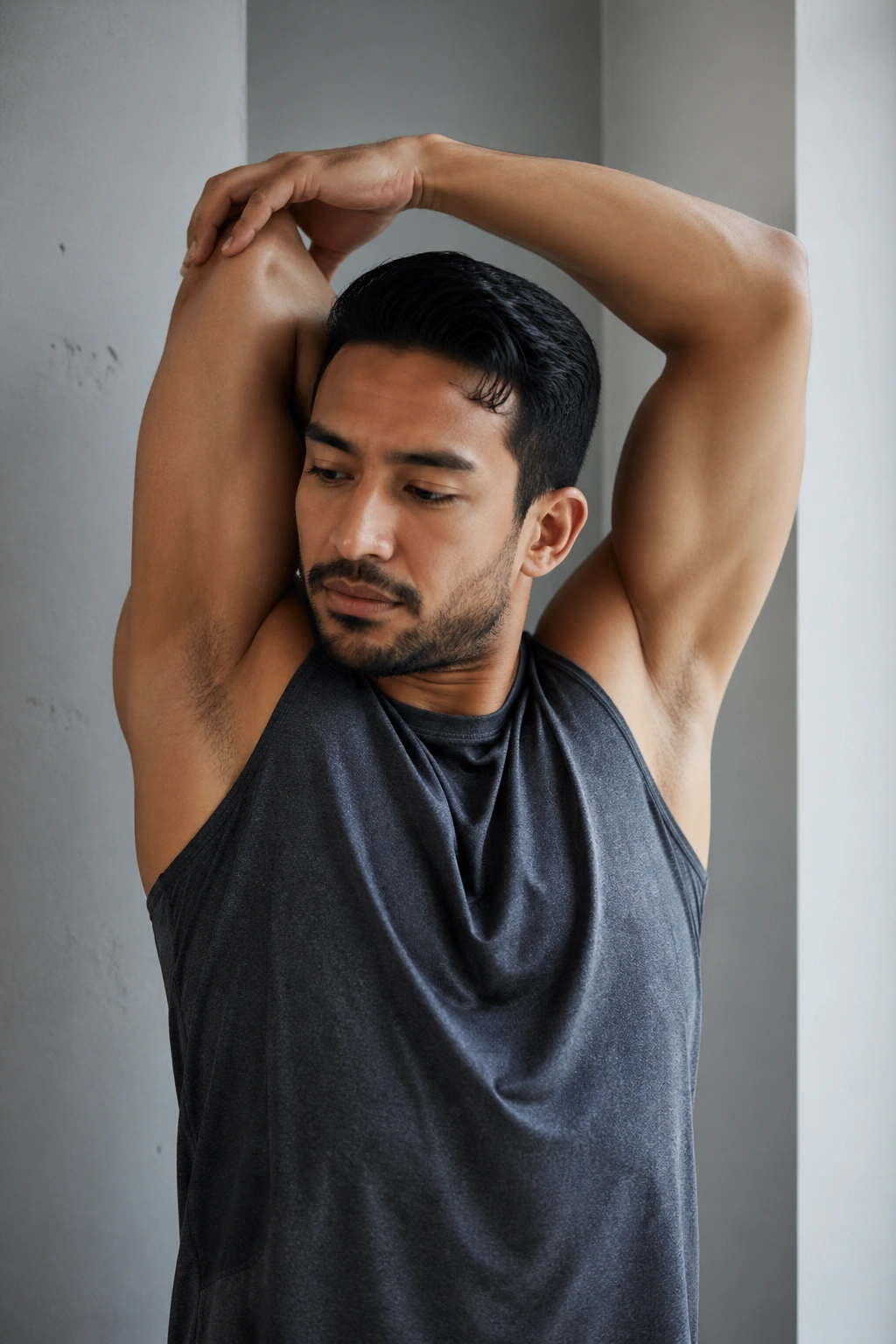 Person performing overhead triceps stretch with elbow bent