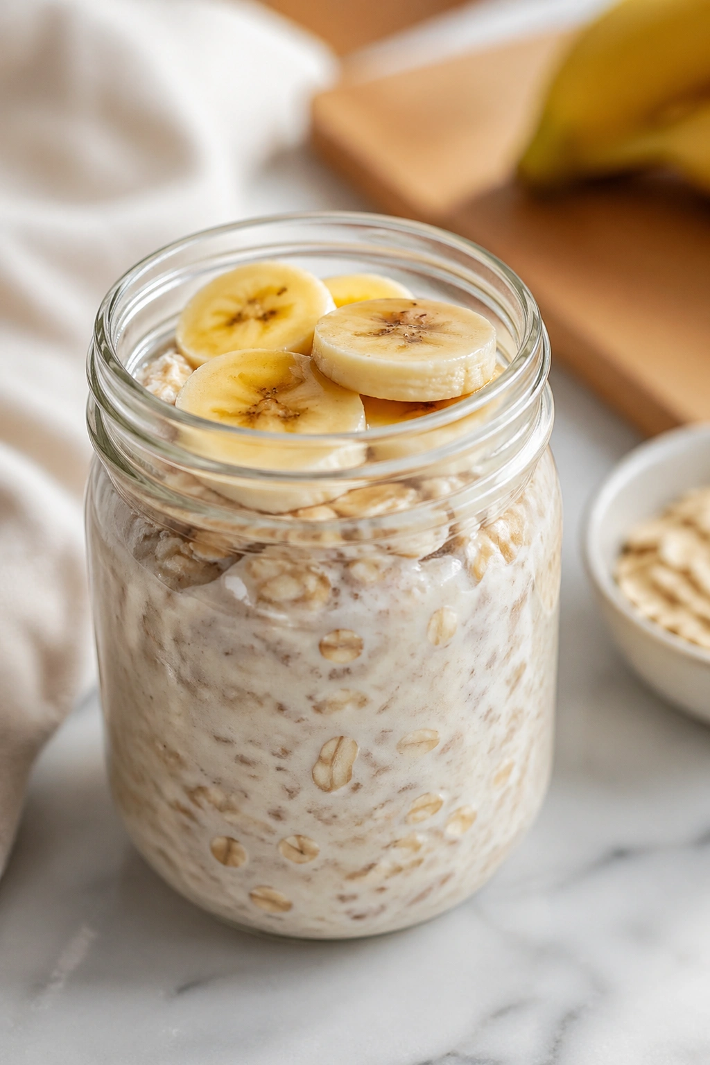 Mason jar of overnight oats, portable pre-workout snack.