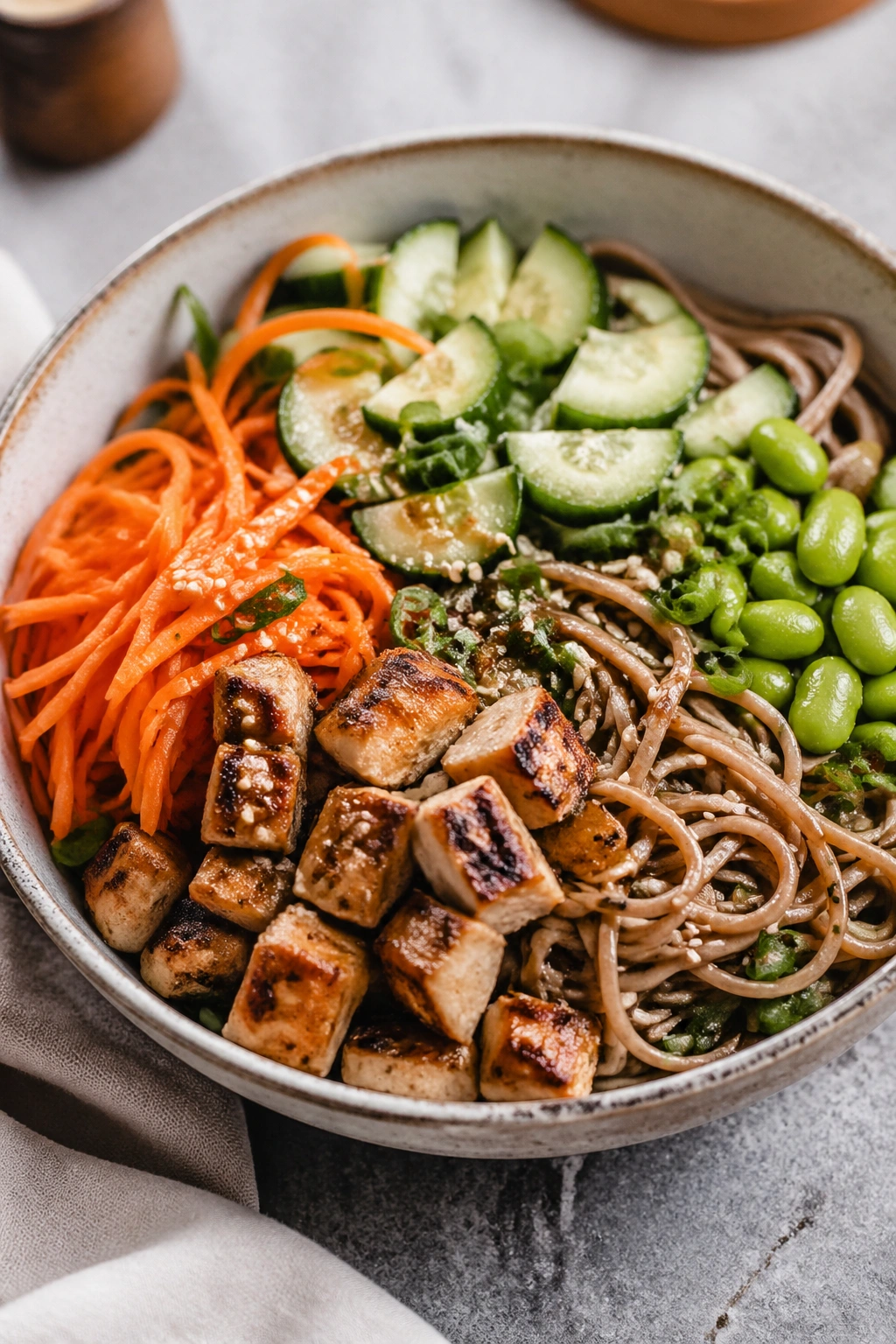 Close-up of soba noodle veggie bowl with vegetables and protein