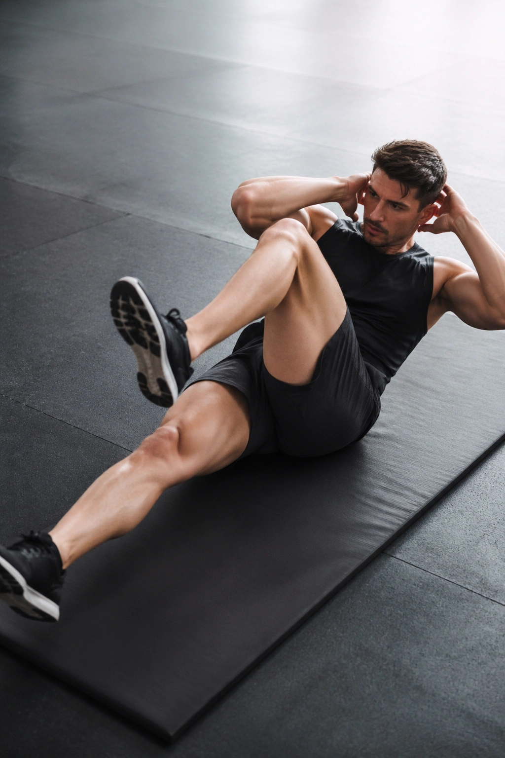 Athlete performing sprinter sit-ups with one leg extended and elbow to knee