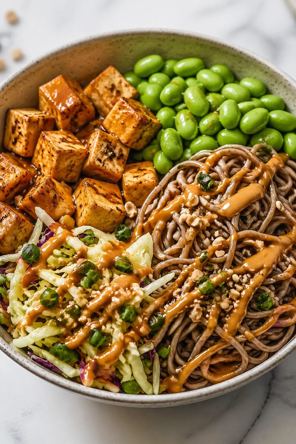 Close-up of Tofu Soba Bowl with peanut sauce and tofu