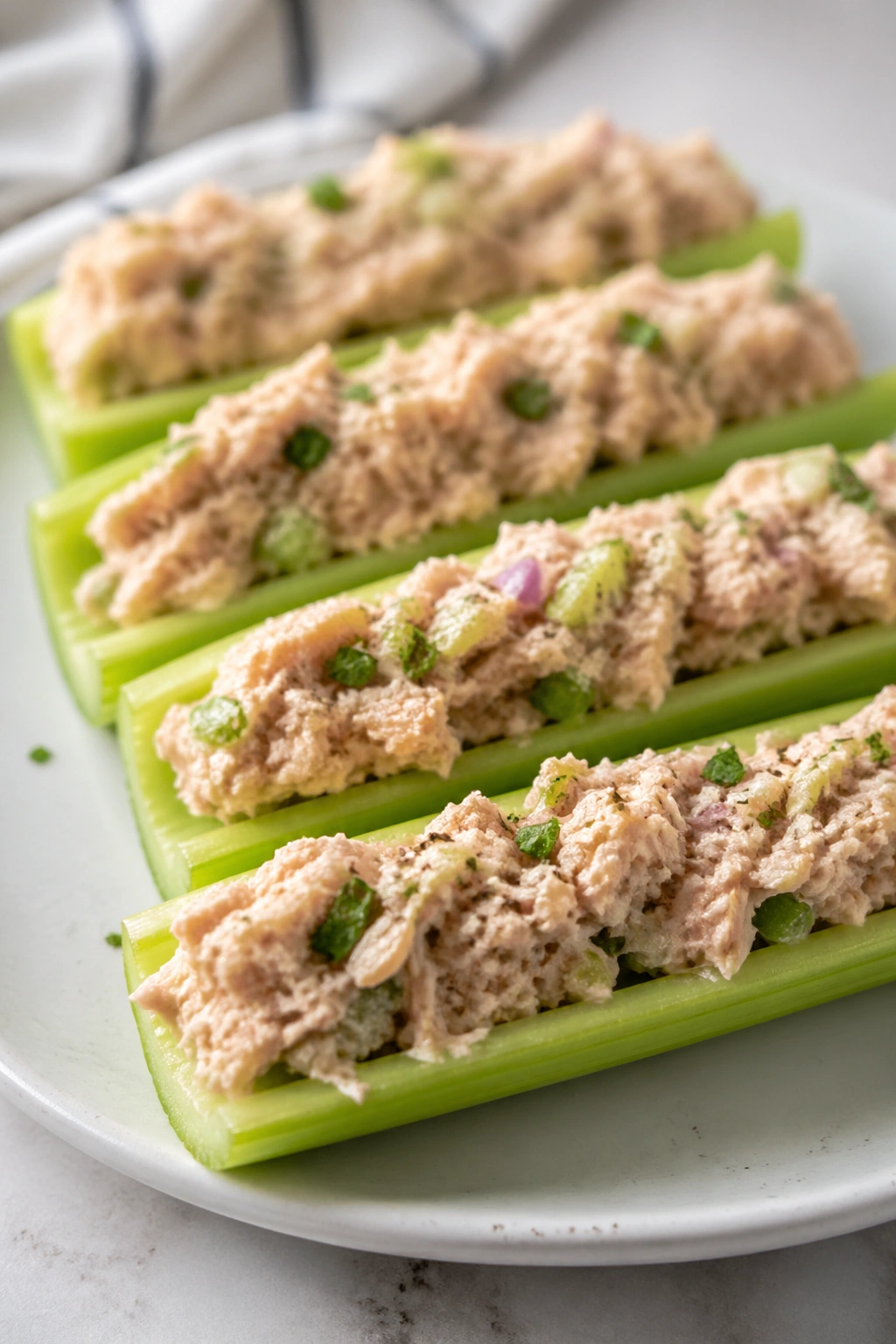 Celery boats filled with tuna salad, keto post-workout snack