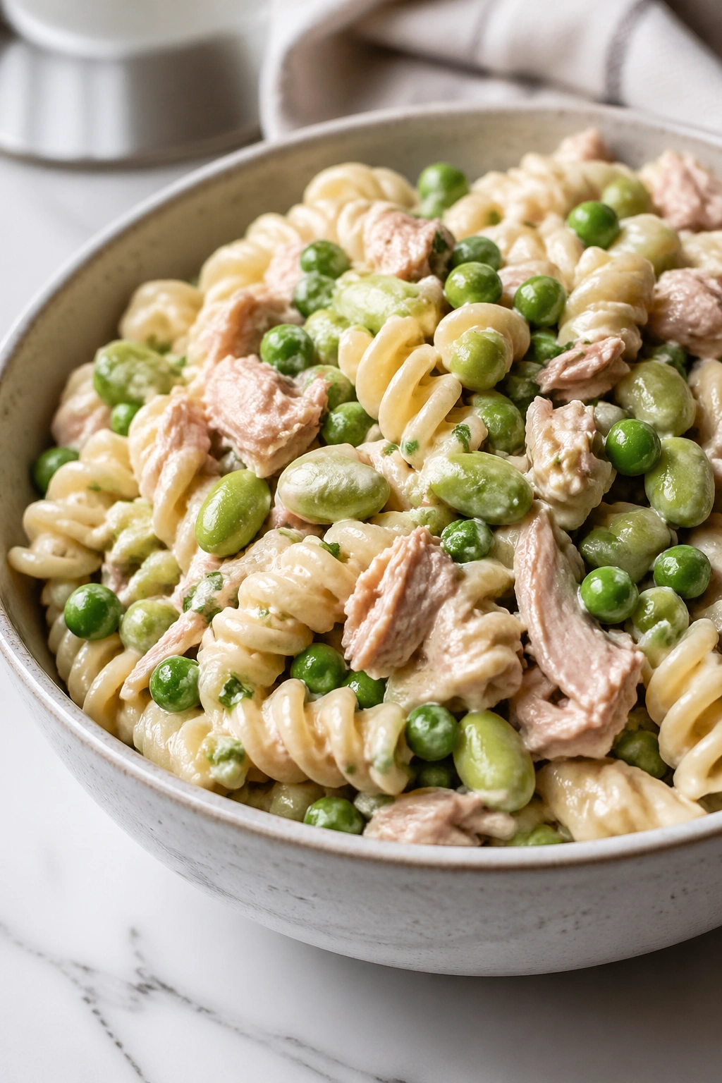 Close-up of Tuna Pasta Salad with Peas and Edamame in a bowl