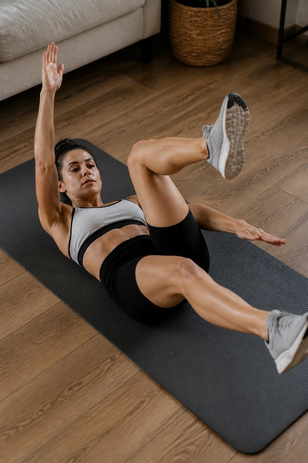 Person performing fast dead bug movements on a mat in a home setting