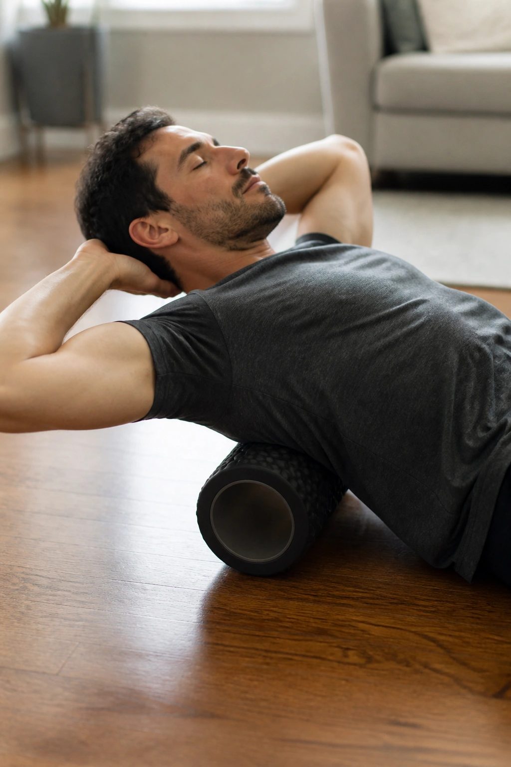 Person using a foam roller for thoracic extension during deload.