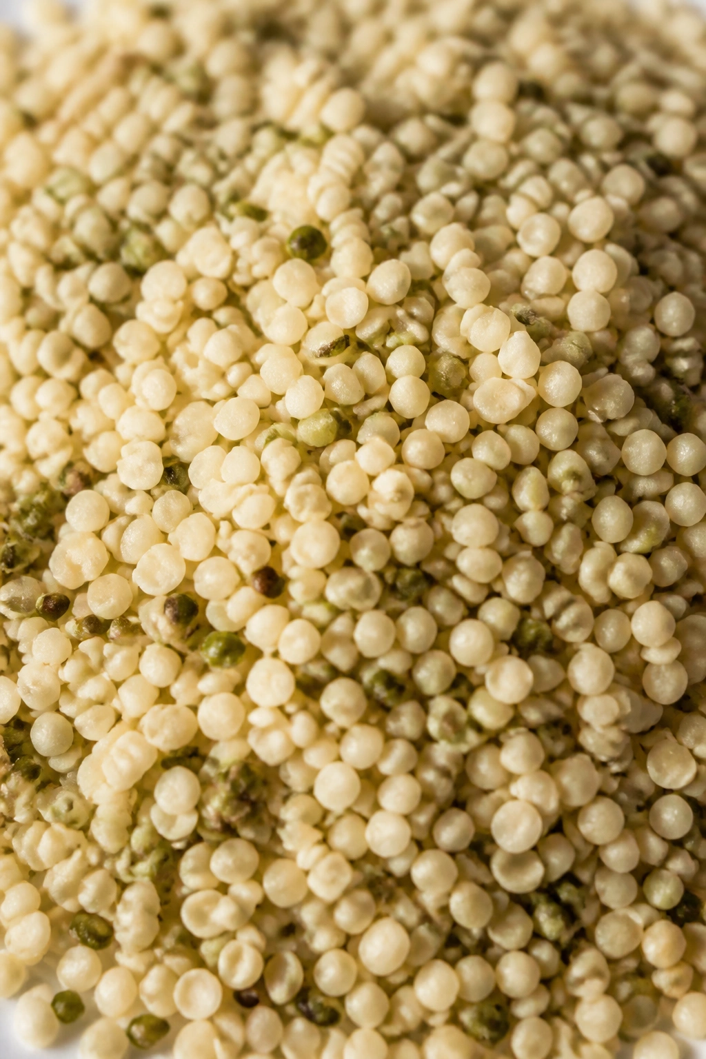 Macro close-up of hemp seeds on neutral surface with bright light