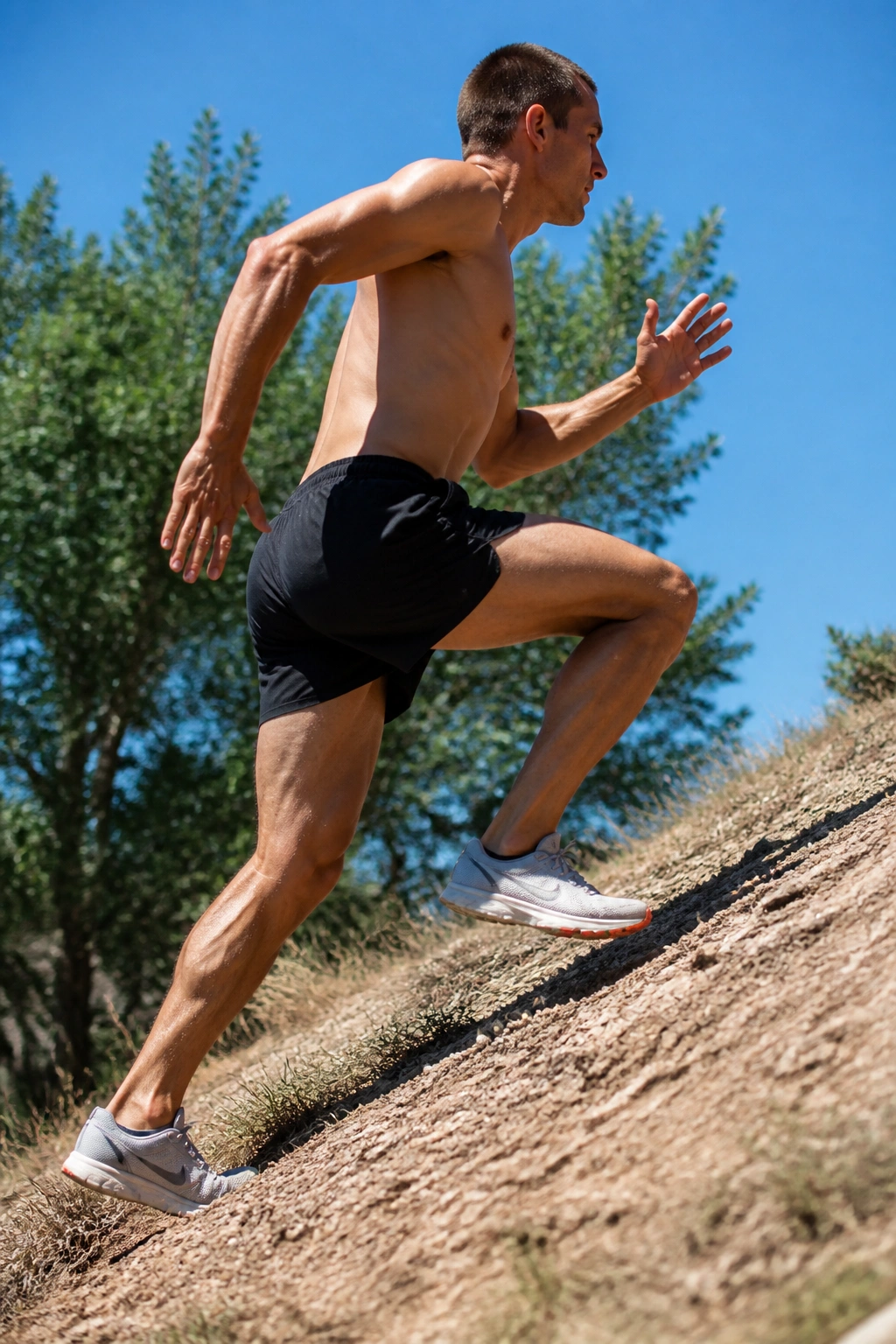 Runner climbing a moderate-grade hill during a 10x15s interval