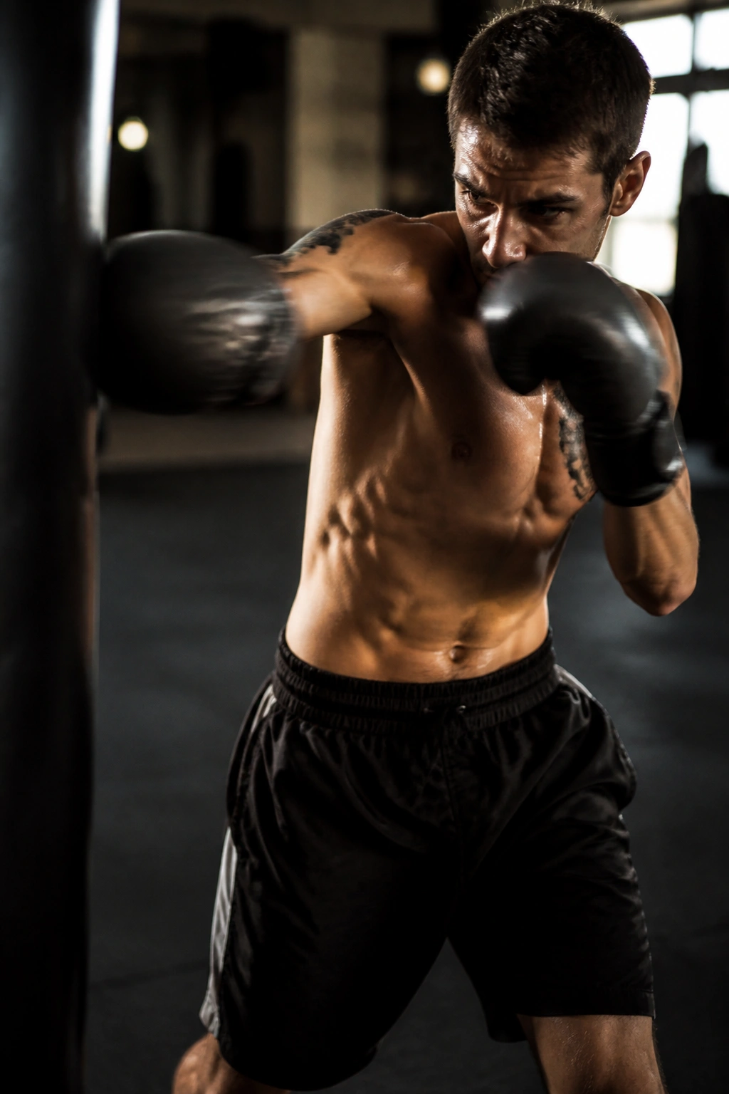 Close-up of a real fighter performing the jab-cross-hook-upper in a gym