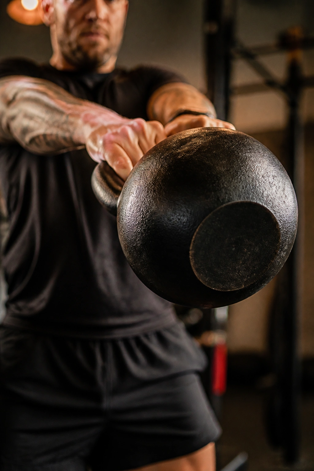 Close-up of a kettlebell during EMOM conditioning in a gym