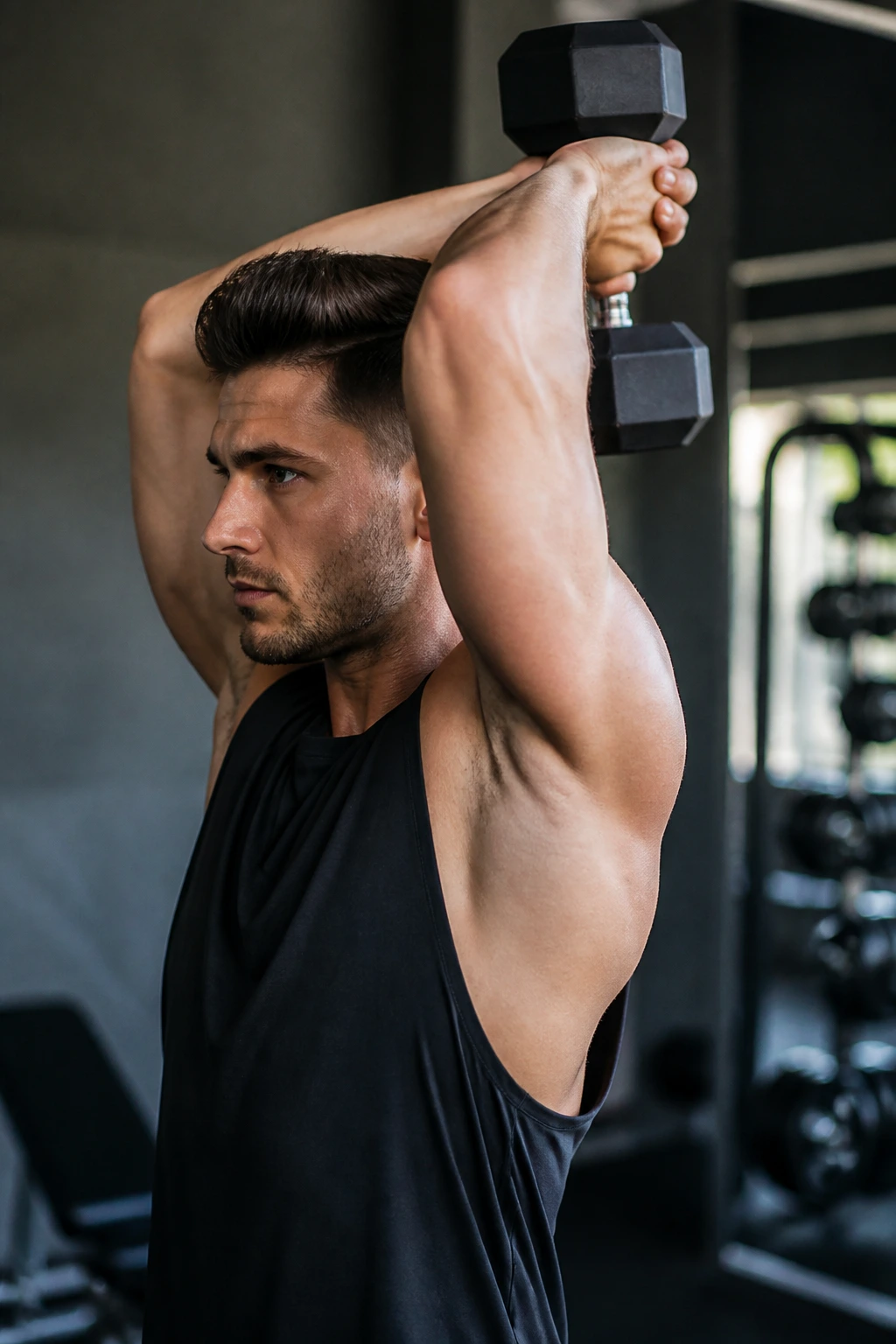 Close-up of a person performing overhead triceps extension.
