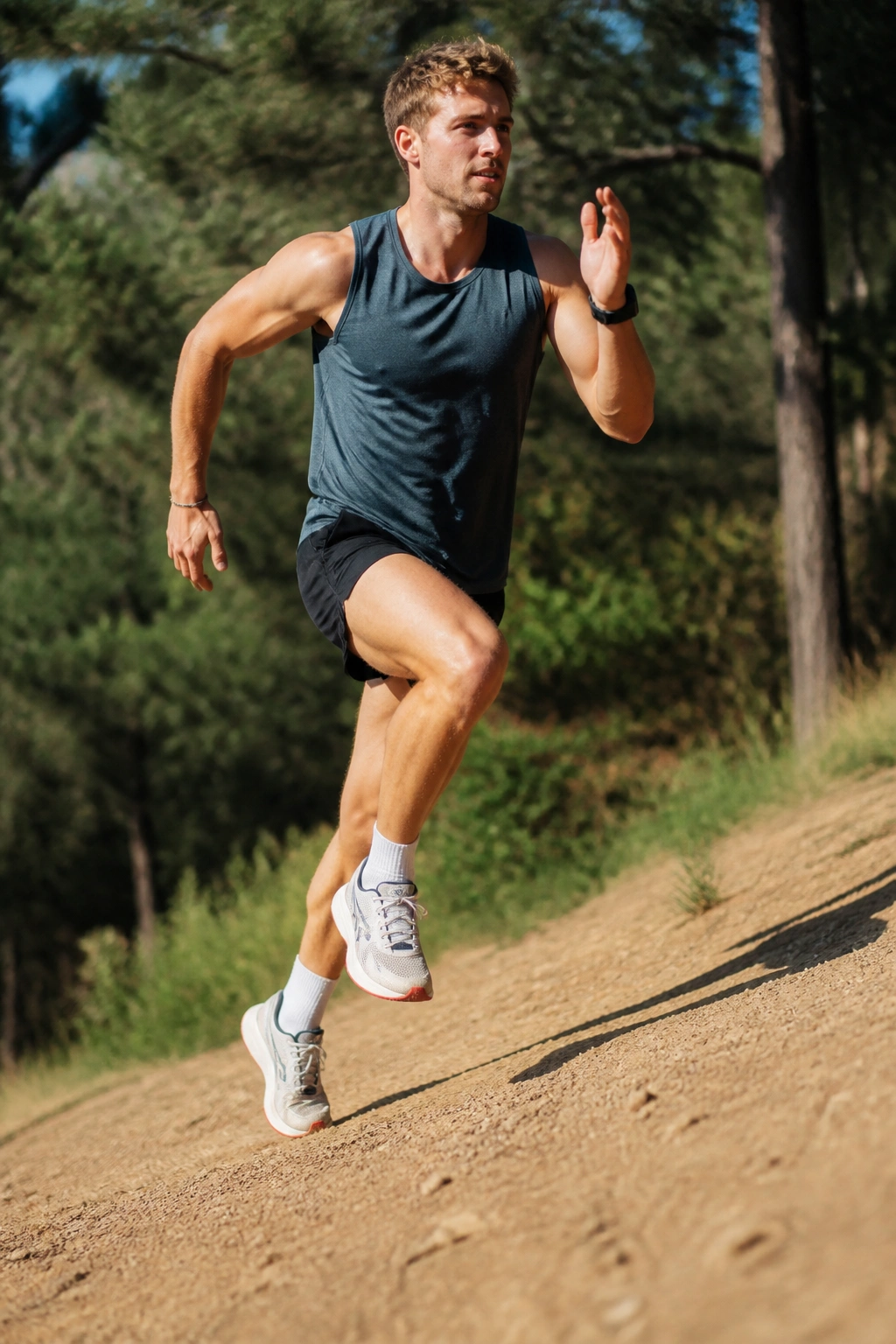 Runner performing race-prep strides on a gentle hill