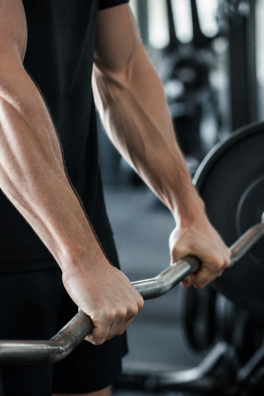 Forearm in reverse curl with overhand grip on EZ bar