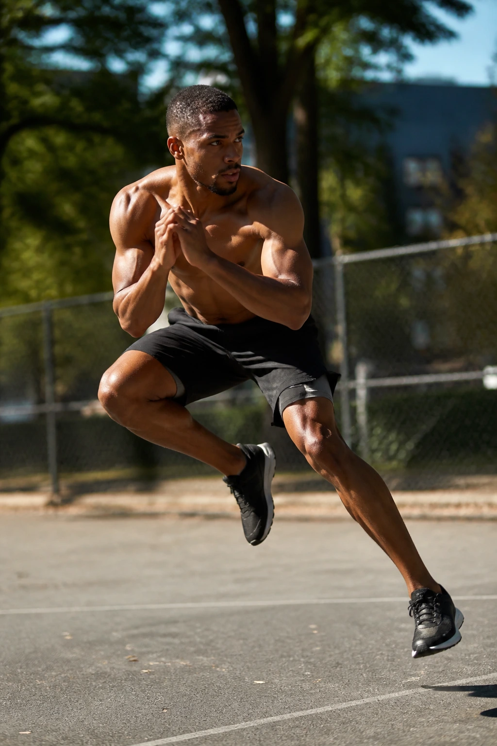 Athlete performing a side-to-side skater squat jump mid-air.
