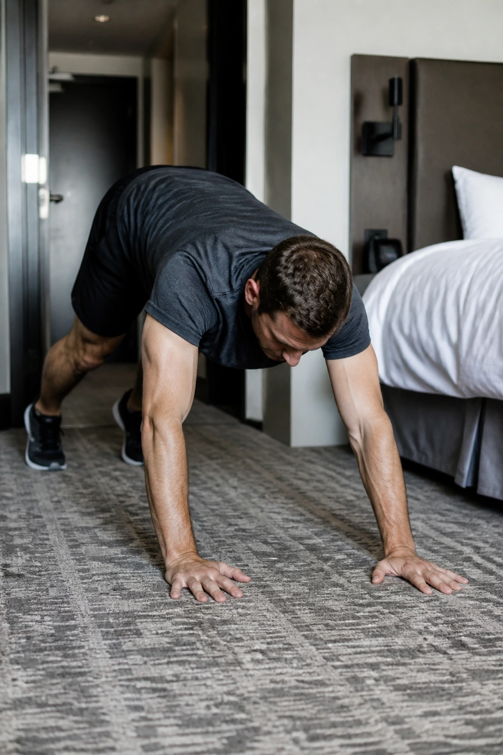Real person performing inchworms in a hotel room for a travel-style circuit
