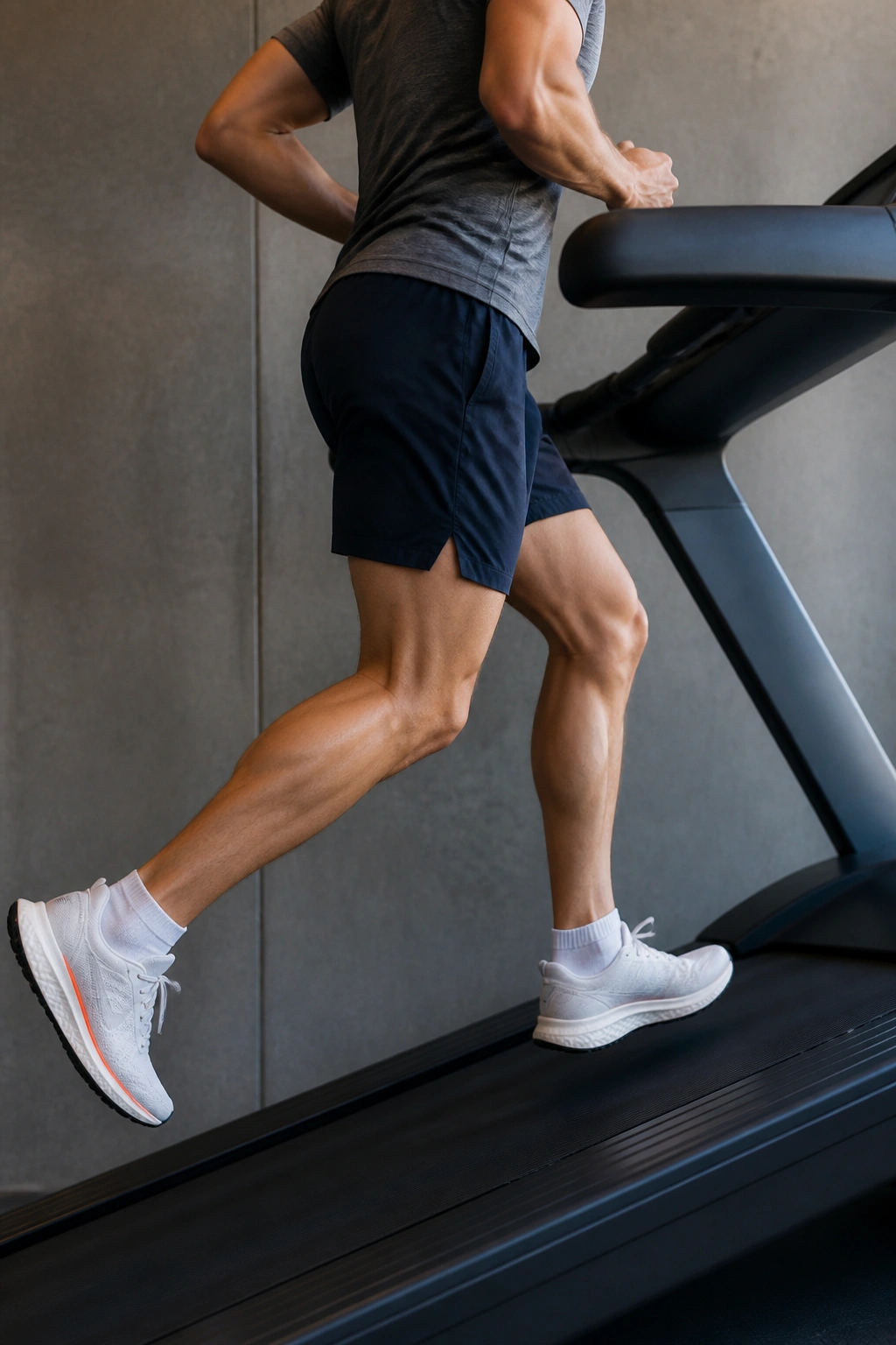 Close-up of runner on treadmill demonstrating incline-focused workout