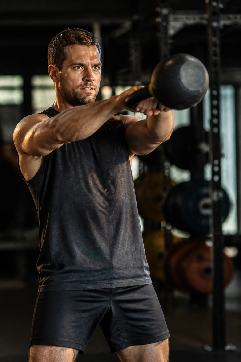 Close-up of a kettlebell swing in a gym, athlete with strong hinge and engaged back