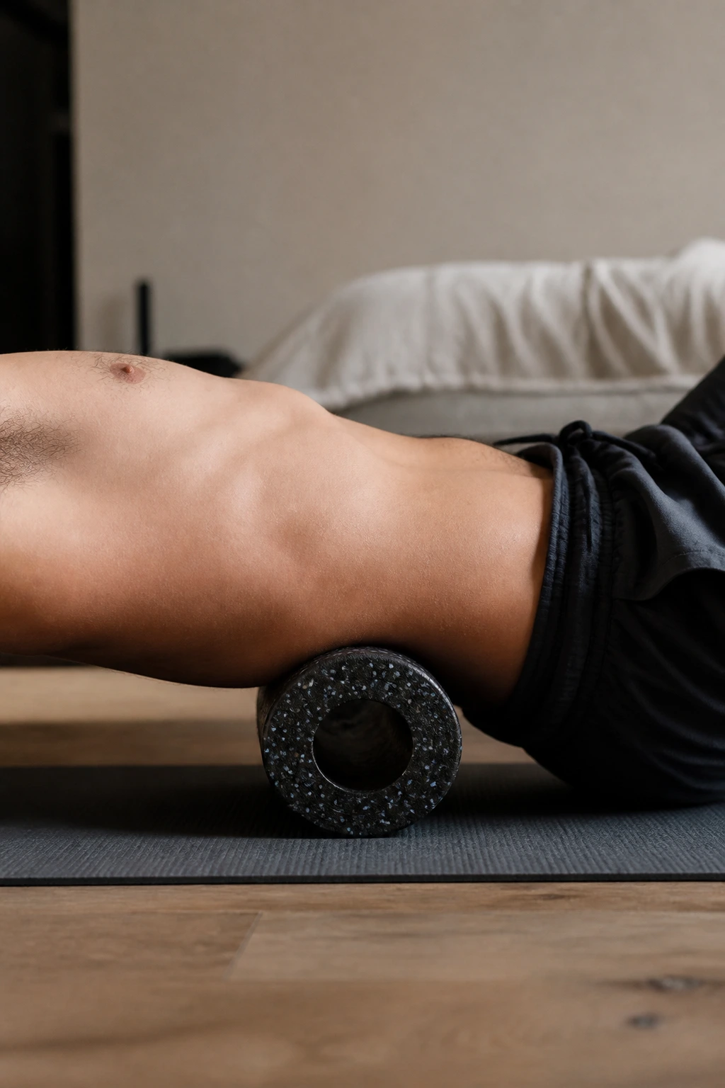 Lower back supported by foam roller for passive release