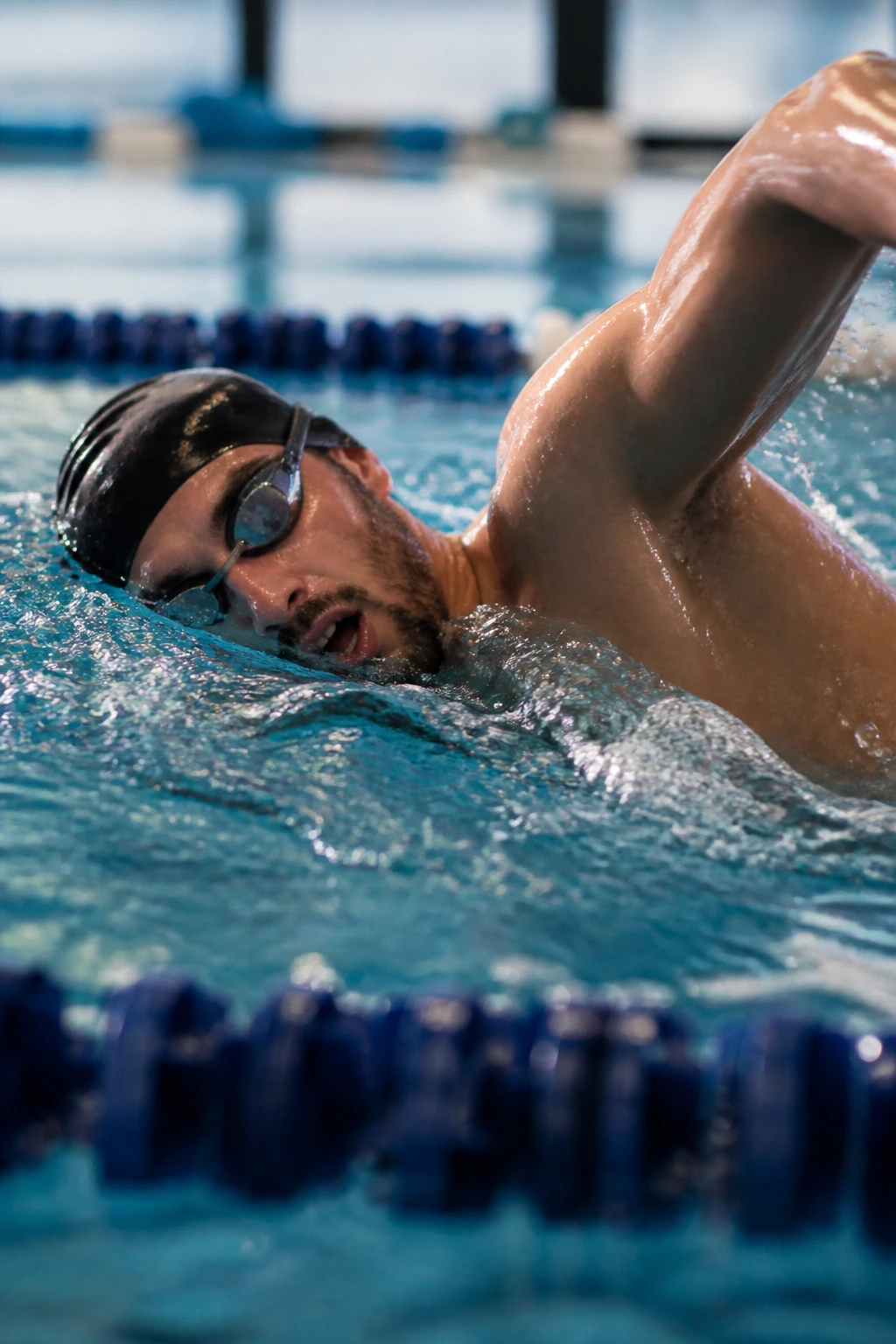 Swimmer in freestyle stroke during lap in pool